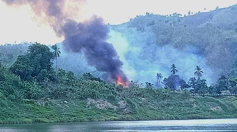 Houses burning in the abandoned village of Meeletwa (lower) in Chin State’s Paletwa Township. Photo Credit: DMG