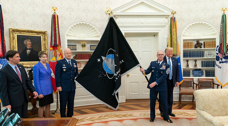 US Space Force CSO GEN Jay Raymond and US Space Force Senior Enlisted Advisor CMSgt Roger Towberman present President Donald J. Trump with the U.S. Space Force Flag Thursday, May 15, 2020, in the Oval Office of the White House. (Official White House Photo by Shealah Craighead)