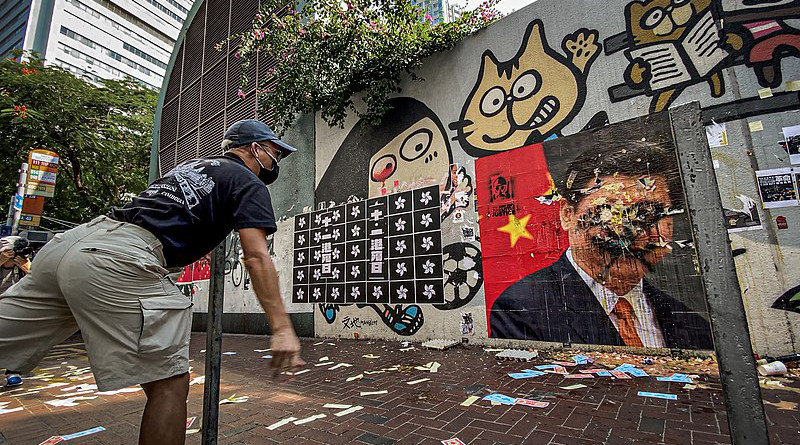 Hong Kong protesters threw eggs at the portrait of General Secretary of the Communist Party of China and paramount leader of China Xi Jinping. Photo Credit: Studio Incendo, Wikipedia Commons