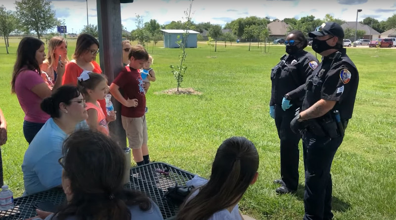 Police officers and "Park Patriots." Photo Credit: Screenshot YouTube video "Park Patriots Freedom Park Mobilization...And Victory," RonPaul Institute