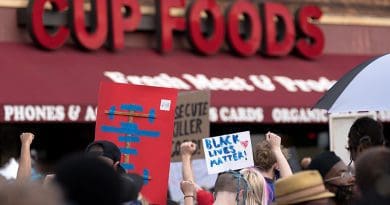 Protesters gather at the site on May 26, the day after George Floyd's death. Photo Credit: Lorie Shaull, Wikipedia Commons.