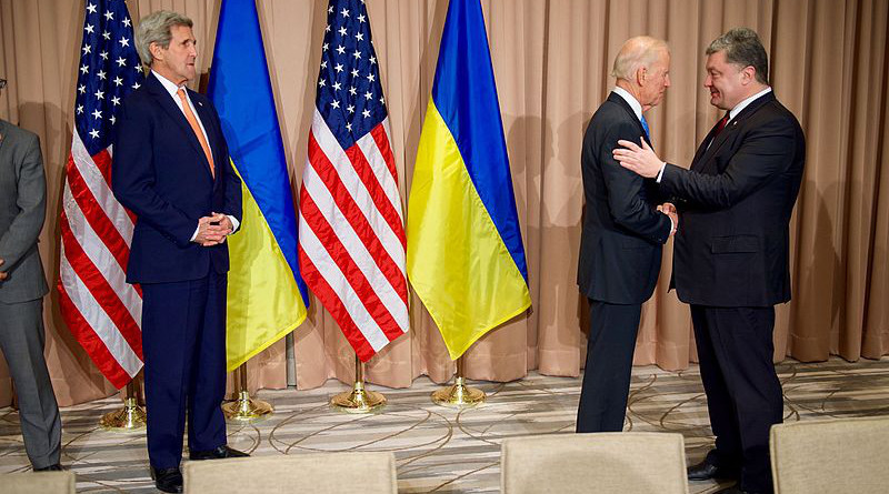 U.S. Secretary of State John Kerry looks as Vice President Joe Biden shakes hands with Ukrainian President Petro Poroshenko on January 20, 2016, at the Intercontinental Hotel in Davos, Switzerland, before a bilateral meeting on the sidelines of the World Economic Forum. [State Department photo/ Public Domain]