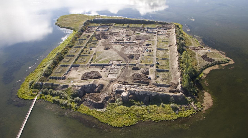 This is an aerial view of Por-Bajin from the west. The complex is situated on an island in a lake. Scientists have pinned its construction on the year 777 CE, using a special carbon-14 dating technique, based on sudden spikes in the carbon-14 concentration. CREDIT Andrei Panin