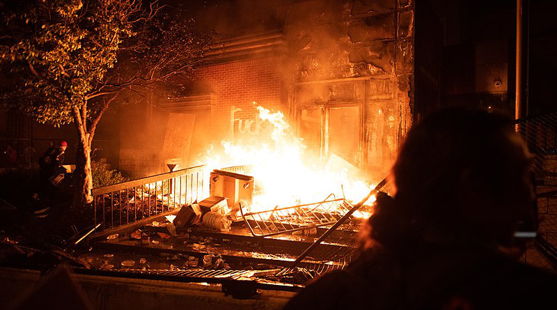 George Floyd protesters overtaking and burning the Minneapolis Police's 3rd Precinct. Photo Credit: Hungryogrephotos, Wikipedia Commons