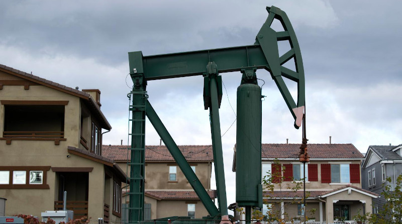A pumpjack operating a well in the Signal Hill neighborhood in Los Angeles County, California. In the San Joaquin Valley, where pumpjacks are also in close proximity to houses, researchers found living near oil and gas development is a risk factor for spontaneous preterm birth. CREDIT: Photo credit: David Gonzalez