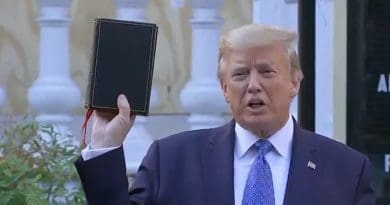 US President Donald Trump holds a bible in front of vandalized St. John’s church in Washington DC