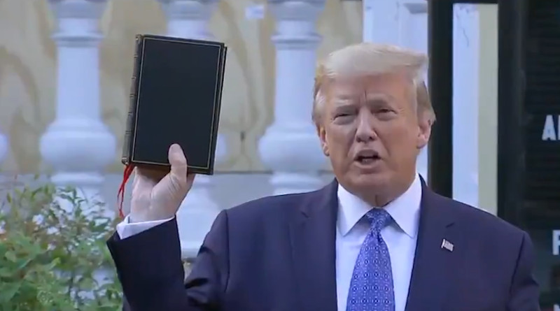 US President Donald Trump holds a bible in front of vandalized St. John’s church in Washington DC