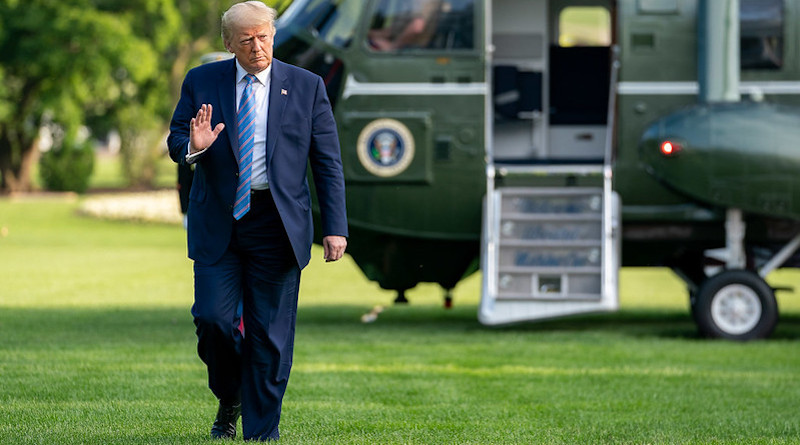 President Donald J. Trump walks across the South Lawn of the White House after disembarking Marine One. (Official White House Photo by Tia Dufour)