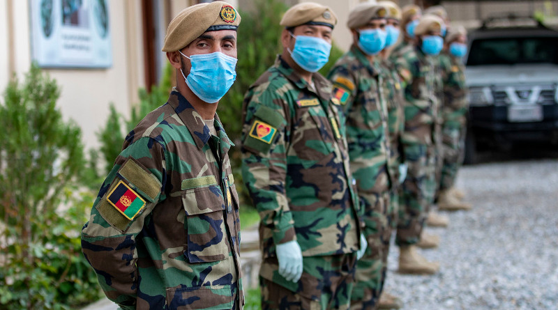 Afghan National Army commandos stand in formation wearing face masks during coronavirus pandemic. Photo Credit: Army Spc. Jeffery J. Harris