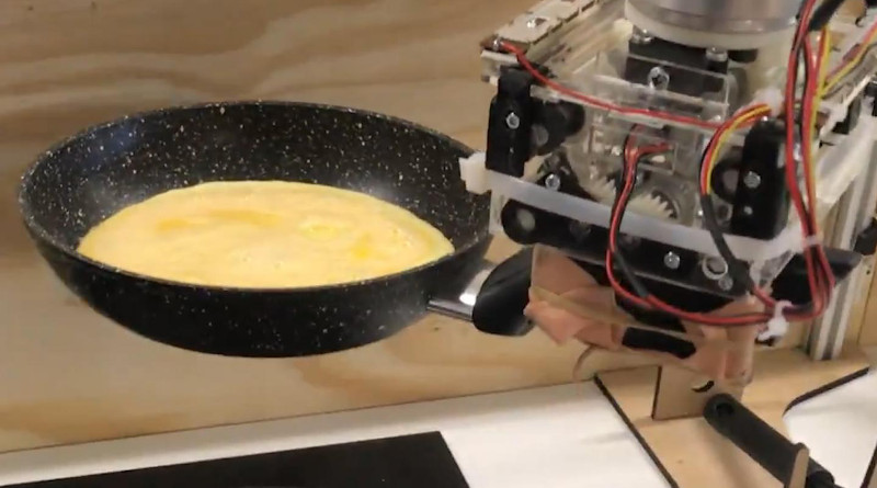 Robot arm preparing an omelette. CREDIT: University of Cambridge