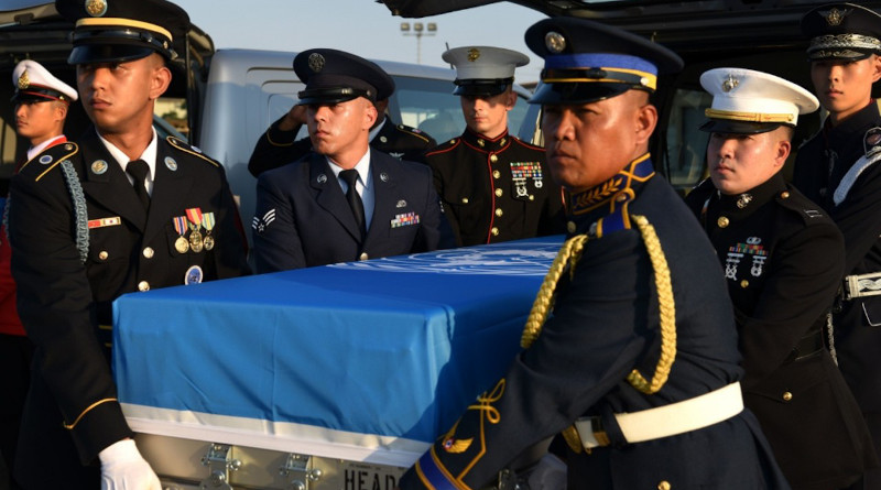 Members from the United Nations Command Honor Guard remove remains of a fallen service member from a vehicle and load it onto a waiting C-17 Globemaster III at Osan Air Base, South Korea, Aug. 1, 2018. The UNC repatriated 55 cases of remains fromNorth Korea. The Defense POW-MIA Accounting Agency will repatriate 147 of those remains to South Korea, June 23, 2020, following their identification as South Korean soldiers. Photo Credit: Air Force Senior Airman Kelsey Tucker