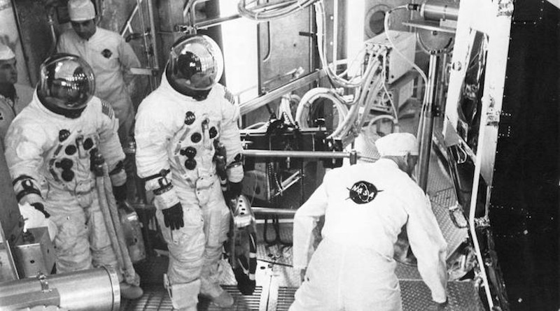Apollo 11 backup crew members Fred Haise (left) and Jim Lovell prepare to enter the Lunar Module for an altitude test. Credit: NASA.