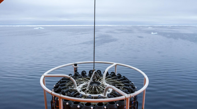 Scientific instruments hang over the ice-free Arctic Ocean during one of the expeditions that contributed data to a recent study published in Frontiers of Marine Science. Sea ice can be seen on the horizon. CREDIT: Photo from Nansen and Amundsen Basins Observational System.