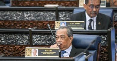 Malaysian Prime Minister Muhyiddin Yassin (front) sits in Parliament in Kuala Lumpur. Photo Credit: S. Mahfuz/BenarNews