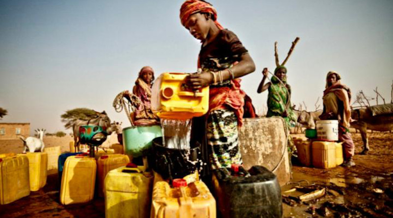 People gather aound a community well in Mauritania, Africa. A severe drought led to a major food crisis in the region in 2012. CREDIT: Oxfam