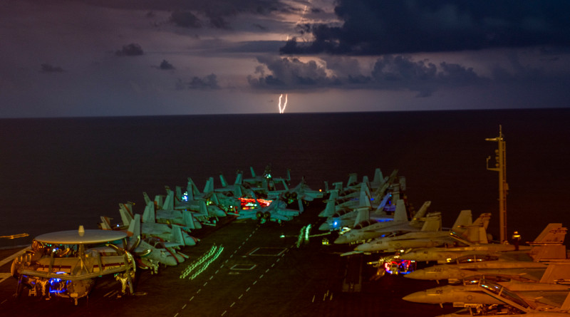 Lightning flashes over the aircraft carrier USS Nimitz (CVN 68) as it transits the South China Sea. Nimitz is the flagship of the Nimitz Carrier Strike Group (CSG). The Nimitz and Ronald Reagan CSGs are conducting dual carrier operations in the South China Sea as the Nimitz Carrier Strike Force. (U.S. Navy photo by Mass Communication Specialist 1st Class John Philip Wagner, Jr./Released)