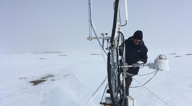 Ecosystem ecologist and post-doctoral fellow Kyle Arndt checking on the measurement equipment set up by SDSU in Utqiagvik (formerly Barrow), Alaska. New research finds that water from spring snowmelt infiltrates the soil and triggers fresh carbon dioxide production at higher rates than previously assumed. CREDIT: SDSU