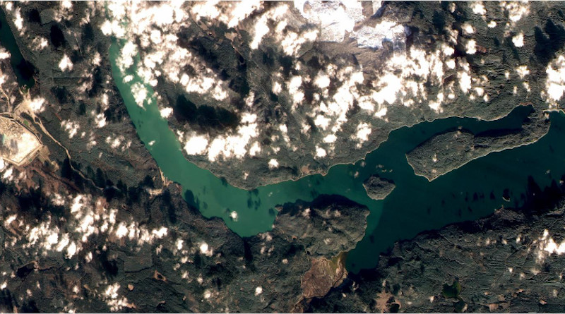 The West Basin of Quesnel Lake turned bright green in November 2014 when contaminants from the August 4, 2014 Mount Polley mine tailings spill were mixed to the surface during autumn turnover. The naturally clear blue waters of the lake are visible to the right. (Image source: FormoSat-2) CREDIT: FormoSat-2