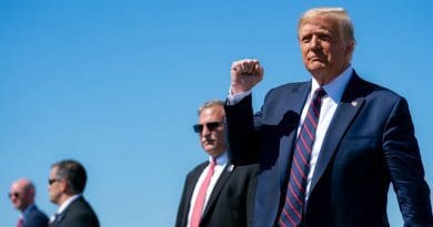 President Donald J. Trump gestures with a fist-pump as he disembarks Air Force One at Wilkes-Barre Scranton International Airport in Avoca, Pa., Thursday, August 20, 2020, and Is greeted by guests and supporters. (Official White House Photo by Tia Dufour)