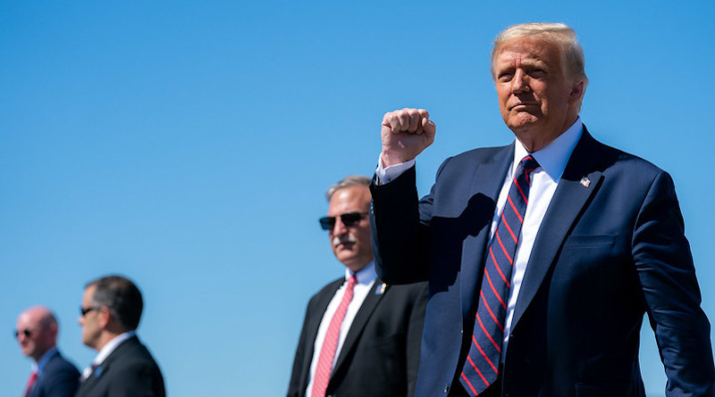 President Donald J. Trump gestures with a fist-pump as he disembarks Air Force One at Wilkes-Barre Scranton International Airport in Avoca, Pa., Thursday, August 20, 2020, and Is greeted by guests and supporters. (Official White House Photo by Tia Dufour)