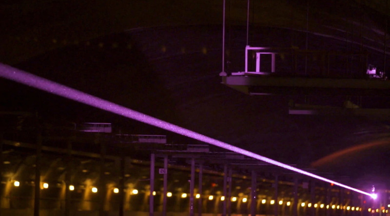 Captured by a special camera, a laser beam, invisible to the naked eye, shoots across the dark expanse of the David Taylor Model Basin at the Naval Surface Warfare Center in Bethesda, Md., May 23, 2019. Photo Credit: Leonard Pieton, Navy