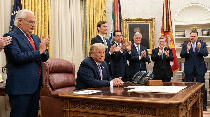 President Donald J. Trump, joined by White House senior staff members, delivers a statement announcing the agreement of full normalization of relations between Israel and the United Arab Emirates Thursday, Aug. 13, 2020, in the Oval Office of the White House. (Official White House Photo by Joyce N. Boghosian)