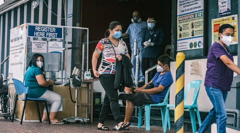 Patients outside the Capitol Medical Center in Quezon City, Philippines, are processed for COVID-19 testing. Photo Credit: Luis Liwanag/BenarNews