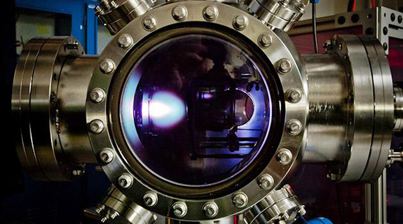 To make the new material, the thin film is first deposited via a pulsed-laser deposition process in this chamber. The bright "plume" you see is the laser hitting the target and depositing the material. CREDIT: Martin/UC Berkeley