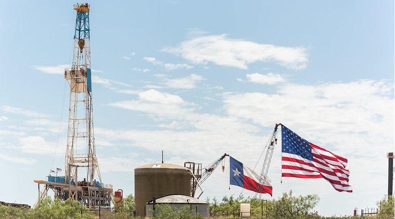 U.S. and Texas flags fly above the stage area where President Donald J. Trump delivered his remarks on restoring energy dominance in the Permian Basin prior to signing presidential permits Wednesday, July 29, 2020, at the Double Eagle Oil Rig in Midland, Texas. (Official White House Photo by Shealah Craighead)