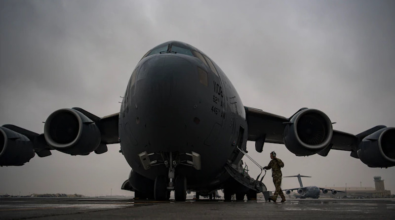 An Air Force C-17 Globemaster III pilot assigned to the 816th Expeditionary Airlift Squadron boards a C-17 at Al Udeid Air Base, Qatar, Jan. 10, 2020. C-17s such as this one are delivering relief supplies to Beirut following an explosion there Aug. 4, 2020. Photo Credit: Air Force Staff Sgt. Daniel Snider