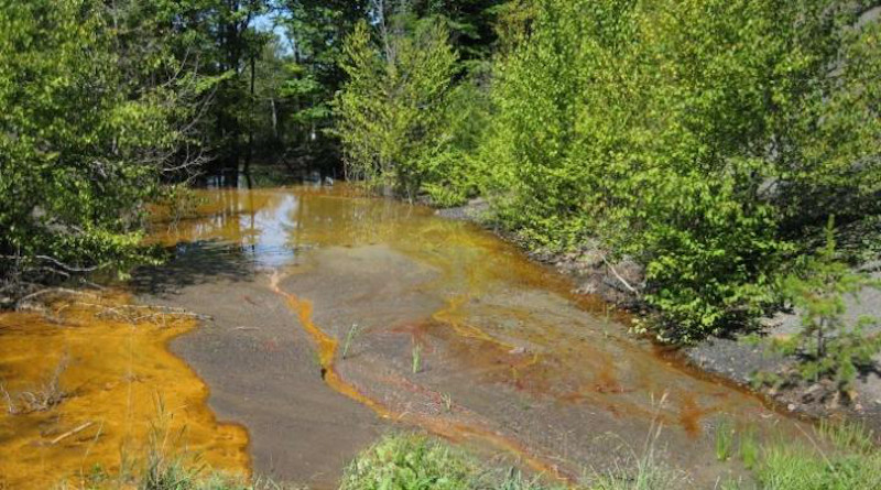 Acid mine drainage pollution in a stream in Cambria County, Pennsylvania. CREDIT: Penn State