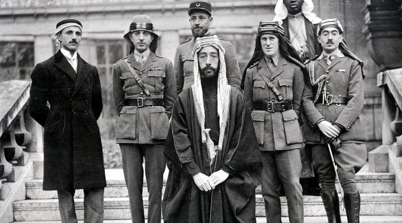 Emir Faisal's delegation at Versailles, during the Paris Peace Conference of 1919. Left to right: Rustum Haidar, Nuri as-Said, Prince Faisal, Captain Pisani (behind Faisal), T. E. Lawrence, unknown person, Captain Tahsin Kadry.