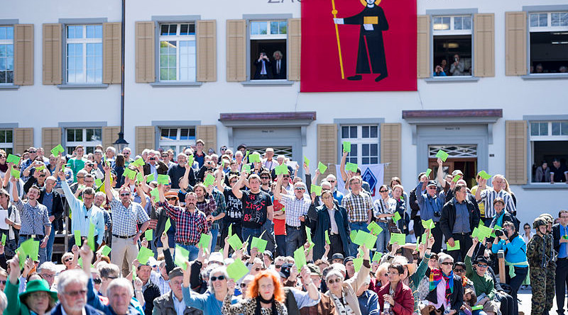 A Landsgemeinde (open-air assembly) in Glarus, Switzerland. Photo Credit: Kanton Glarus, Samuel Trümpy Photography, Wikipedia Commons