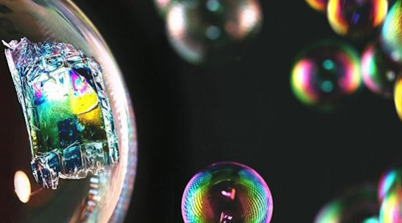 The fully printed ultrathin solar cell is light and flexible enough to rest on the surface of a soap bubble. CREDIT: © 2020 KAUST; Anastasia Serin