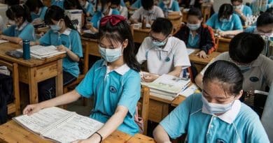 Students in China wearing masks to prevent coronavirus spread. Photo Credit: Tasnim News Agency