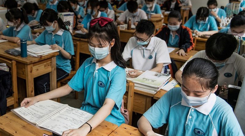 Students in China wearing masks to prevent coronavirus spread. Photo Credit: Tasnim News Agency