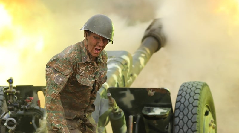 An Armenian soldier from Nagorno-Karabakh fires artillery towards Azerbaijan positions. Photo Credit: Armenian Defense Ministry