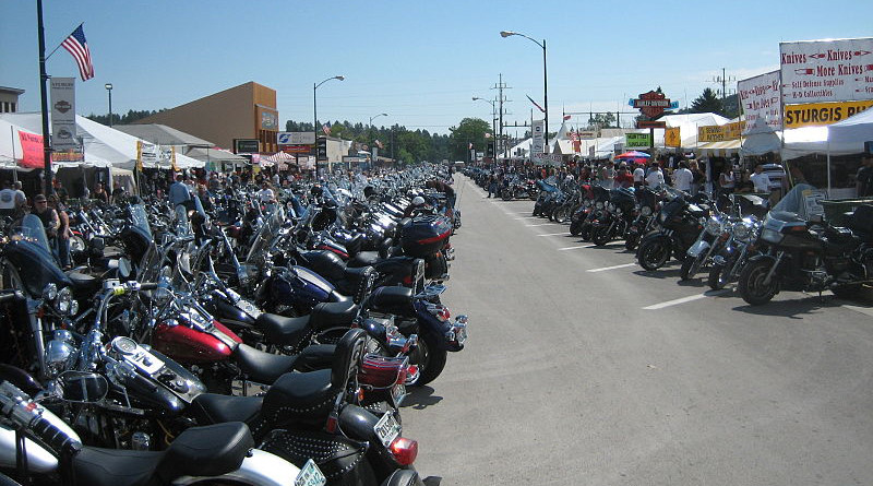 Bikes lined up on Main Street during Bike Week, Sturgis, South Dakota. Photo Credit: Cumulus Clouds, Wikipedia Commons