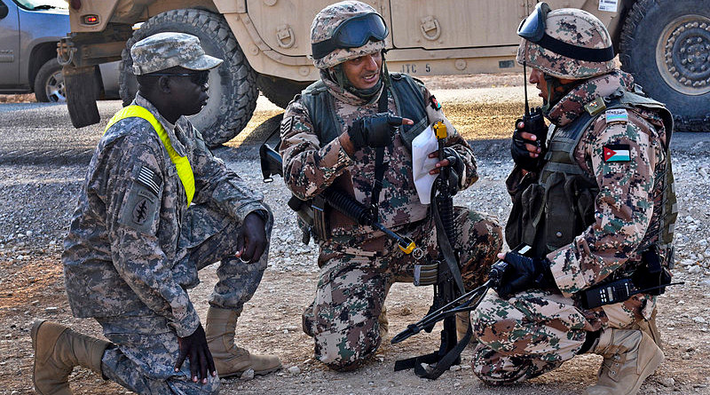 Jordanian soldiers discuss battle strategies with a U.S. Soldier. Photo Credit: Cpl Jordan Johnson/13th Public Affairs Detachment/U.S. Army, Wikipedia Commons
