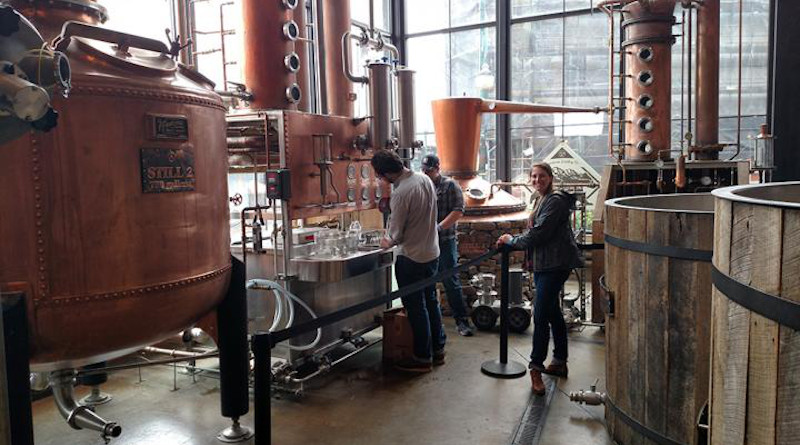 UT Department of Food Science graduate students collecting whiskey distillate samples for chemical analysis at the Sugarlands Distilling Company in Gatlinburg, Tennessee. Pictured are co-author Trenton Kerley, Melissa Dein, and Jordan Lopez. CREDIT: Photo by J. Munafo, courtesy UTIA.