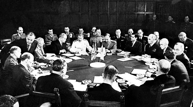 A session of the Potsdam Conference – those pictured include Clement Attlee, Ernest Bevin, Vyacheslav Molotov, Joseph Stalin, William D. Leahy, James F. Byrnes, and Harry S. Truman. Photo Credit: Bild, Wikimedia Commons