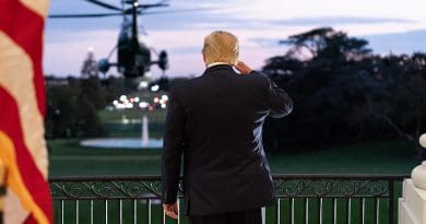 President Donald J. Trump salutes Marine One from the Blue Room Balcony of the White House. (Official White House Photo by Andrea Hanks)
