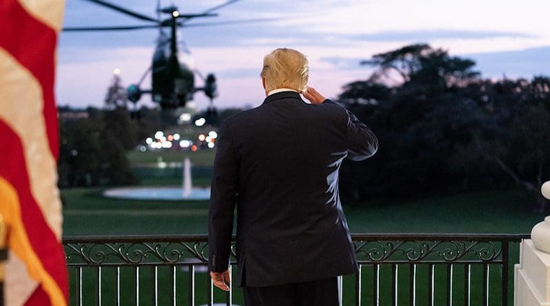 President Donald J. Trump salutes Marine One from the Blue Room Balcony of the White House. (Official White House Photo by Andrea Hanks)