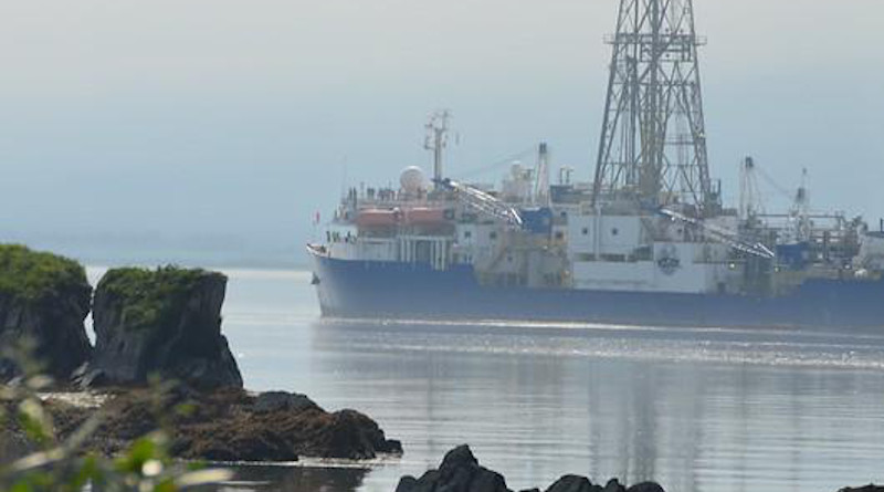 The JOIDES Resolution, a research vessel that drills into the ocean floor to collect and study core samples is seen at the Port of Valdez. The JR is a part of the International Ocean Discovery Program and is funded by the National Science Foundation. CREDIT: Bill Mills, IODP/TAMU [Photo ID: exp346_003]