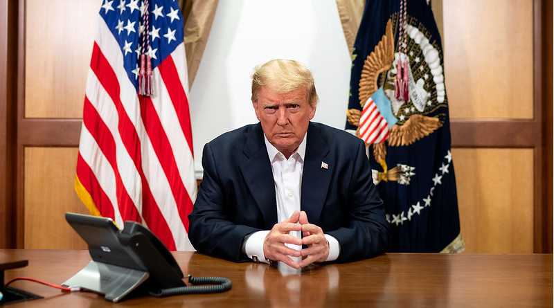 President Donald J. Trump, joined by Chief of Staff Mark Meadows, participates in a phone call with Vice President Mike Pence, Secretary of Defense Mark Esper, Secretary of State Mike Pompeo, Chairman of the Joint Chiefs of Staff Gen. Mark Milley and National Security Advisor Robert O’Brien Sunday, Oct. 4, 2020, in his conference room at Walter Reed National Military Medical Center in Bethesda, Md. (Official White House Photo by Tia Dufour)