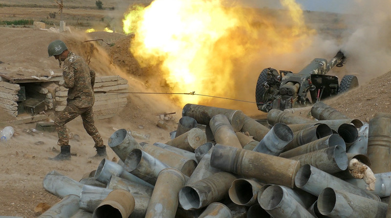 An Armenian soldier in Nagorno-Karabakh fires artillery towards Azerbaijan positions. Photo Credit: Armenian Defense Ministry