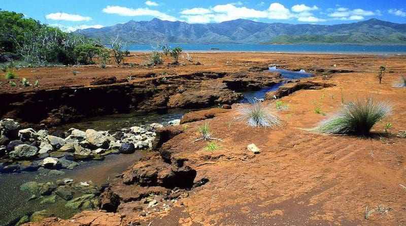 A creek in southern New Caledonia. Red colours reveal the richness of the ground in iron oxides and nickel.) CC BY 2.5