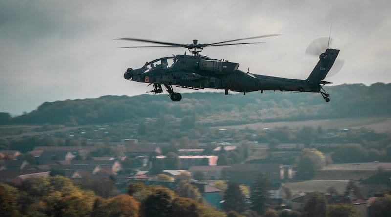A U.S. Army AH-64 Apache attack helicopter from the 12th Combat Aviation Brigade flies over the town of Belfort, France, in a "show of force" fly-by during distinguished visitors' demonstration day for NATO Exercise Royal Blackhawk 20. Photo Credit: Maj. Robert Fellingham, Army