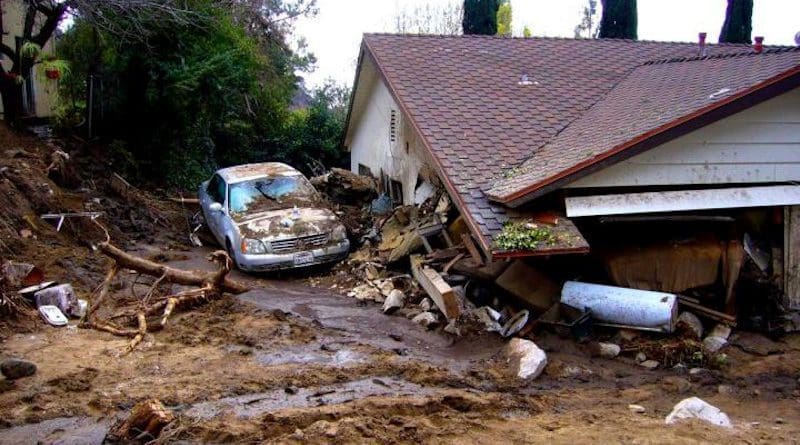 House damaged by debris flows generated in Los Angeles County's Mullally Canyon in response to a rainstorm on February 6, 2010. CREDIT: Susan Cannon/USGS