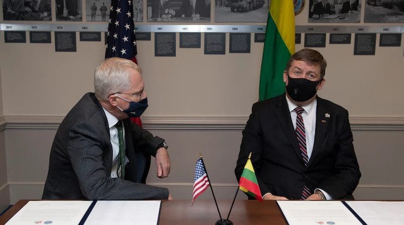 Acting Secretary of Defense Christopher C. Miller signs an agreement with Raimundas Karoblis, the Lithuanian Minister of National Defense, during a meeting at the Pentagon, Nov. 13, 2020. Photo Credit: Marv Lynchard, DOD